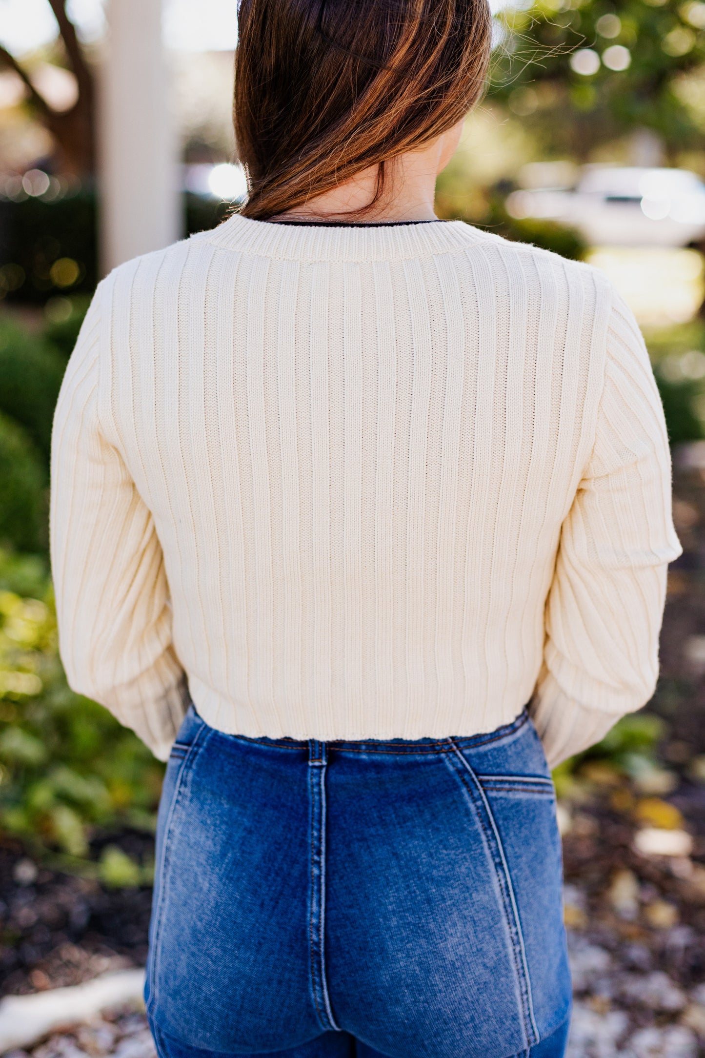 MAIN CHARACTER ASSYMETRICAL HEM SWEATER