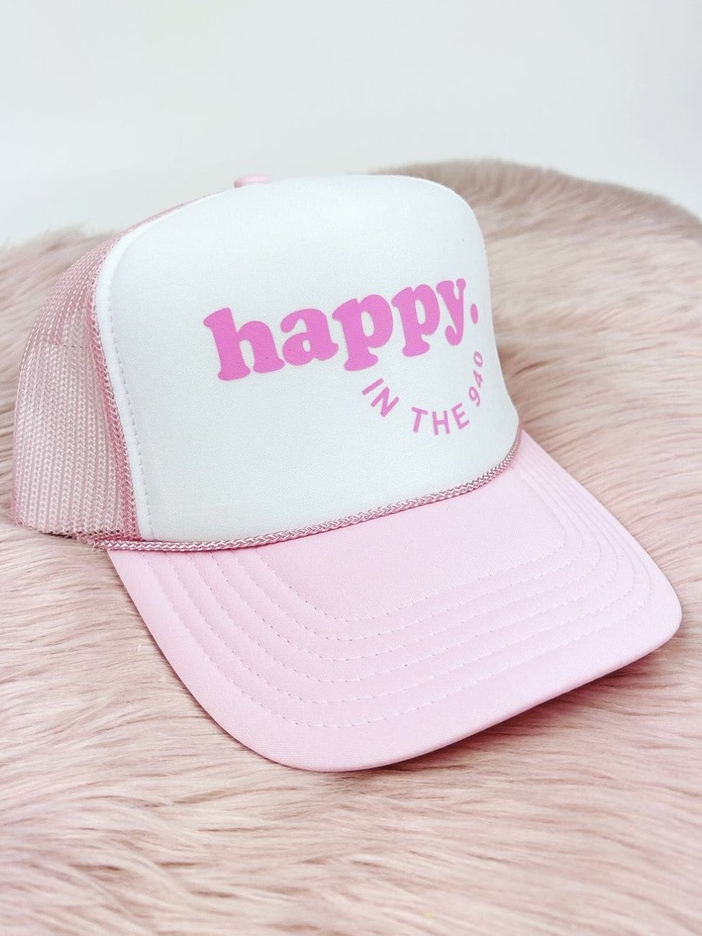 Happy in the 940 Trucker Hat