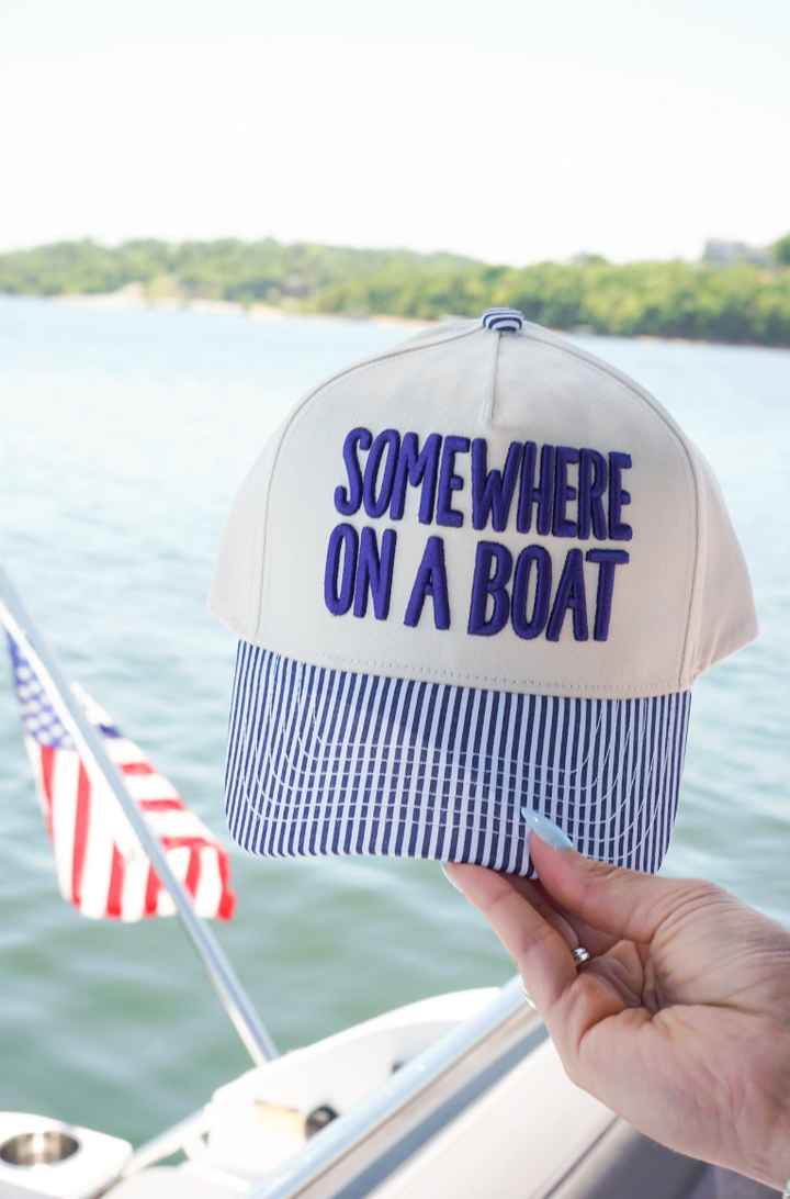 SOMEWHERE ON A BOAT TRUCKER HAT