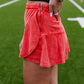 WASHED RED WRAP MINI SKORT