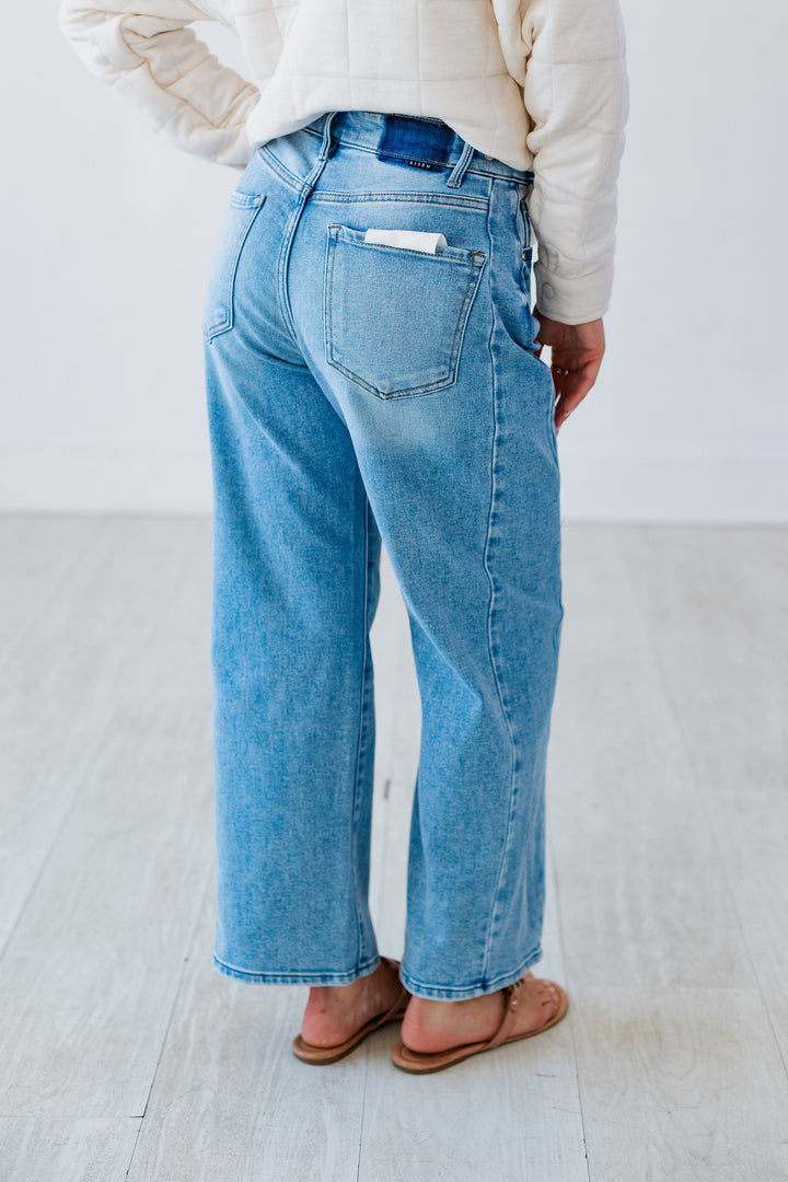 RISEN: LIGHT DENIM ADJUSTABLE WAIST BARREL JEAN