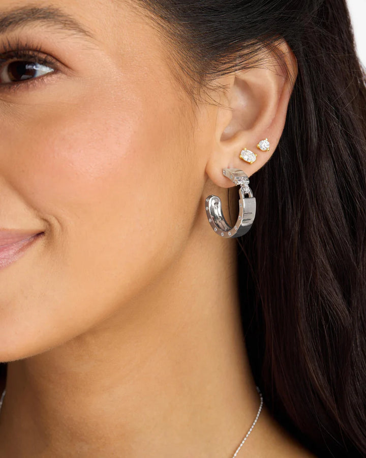 MELINDA MARIA: ASHLEY LOCK 1" HOOPS- SILVER